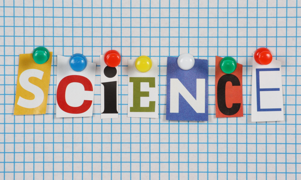 The word Science in cut out magazine letters pinned to a cork notice board