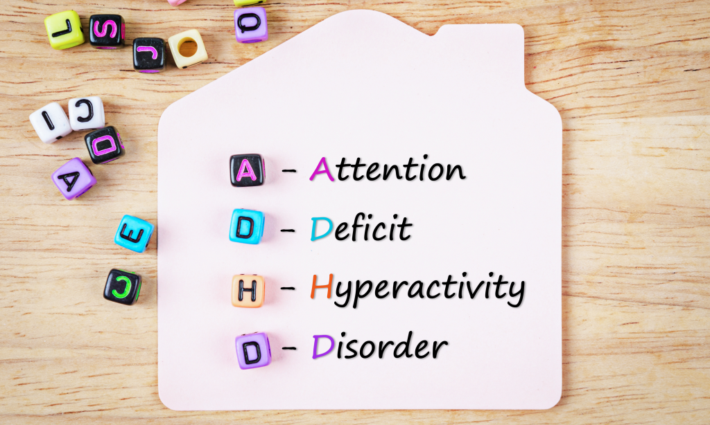 Attention Deficit Hyperactivity Disorder or ADHD concept with colored cubes against toys