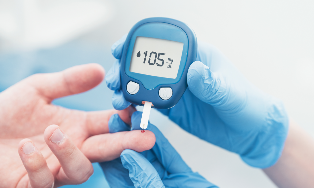 doctor checking blood sugar levels with glucometer. Treatment of diabetes concept