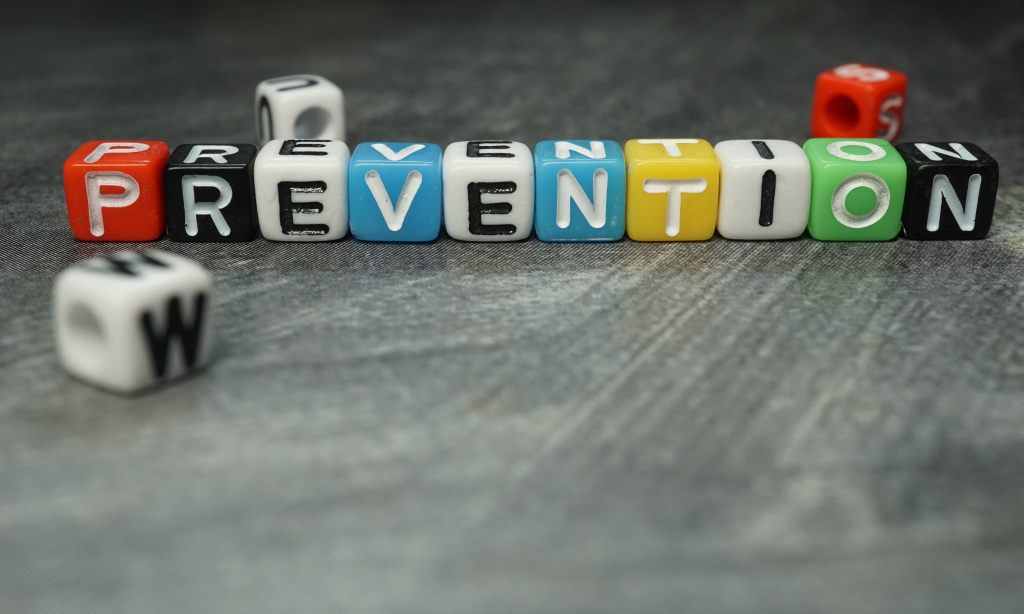close up shot of letter blocks spelling the word prevention