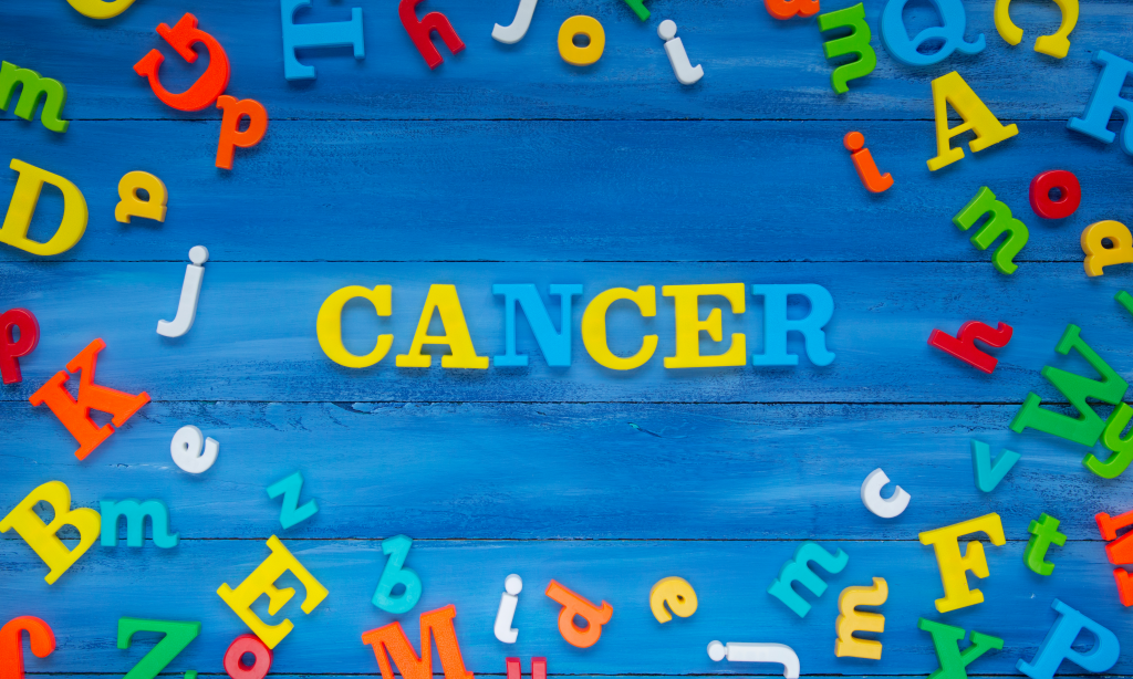 cancer, word. on blue background with colourful letters