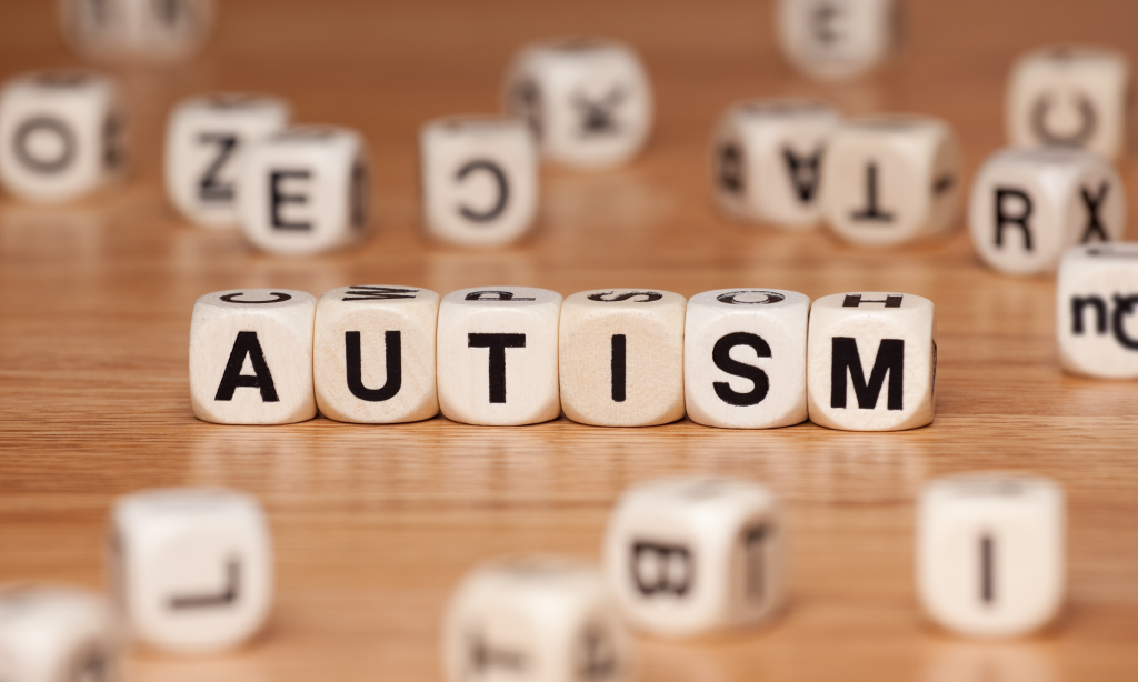 the word autism spelled out in letter cubes